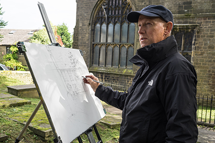 Robert on location at St Michael and All Angels’ Parish Church (Church of England) drawing the Bronte Parsonage Museum, Haworth, in West Yorkshire