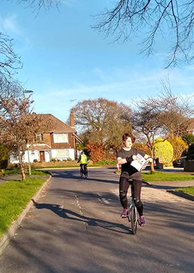 Emma on her unicycle